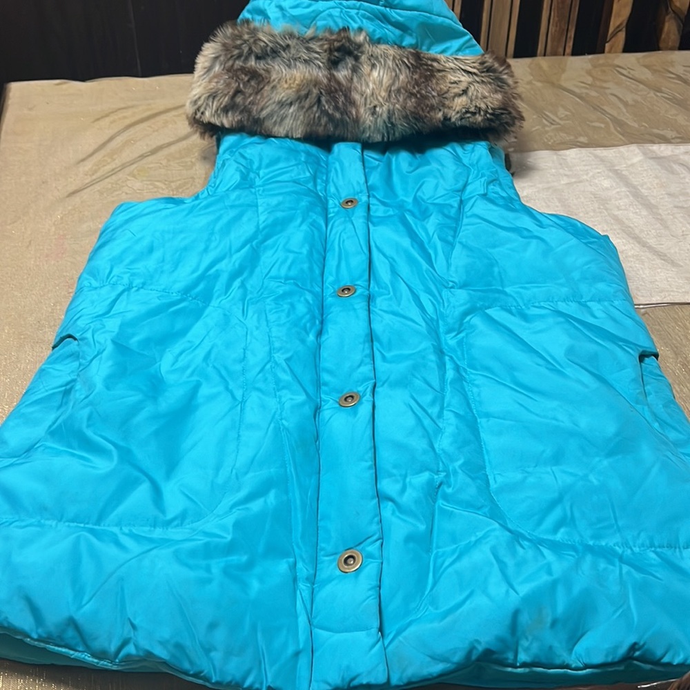 Weather solutions vest with detachable hood